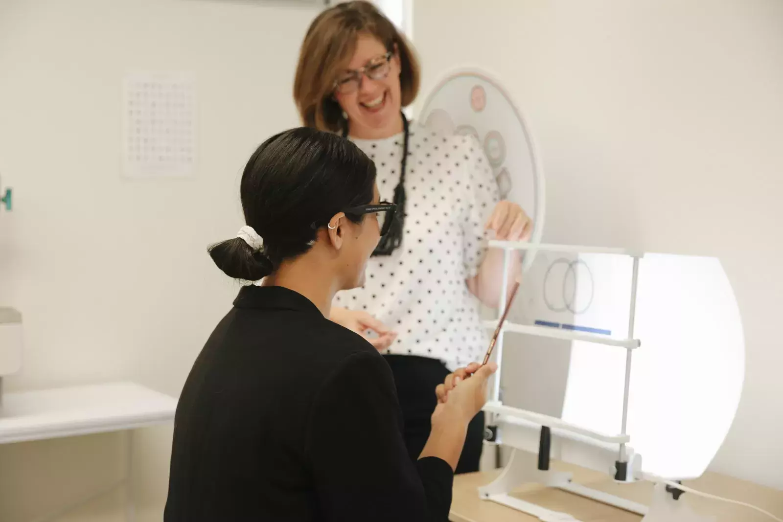 Optometrist with a patient